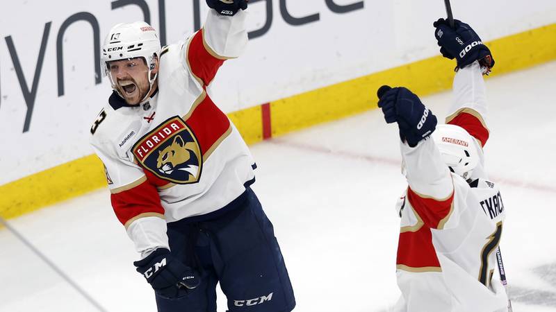 Florida Panthers' Sam Reinhart (13) and Matthew Tkachuk celebrate after the tying goal by...