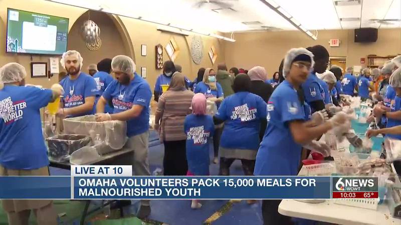 Omaha volunteers pack food for malnourished kids across the globe